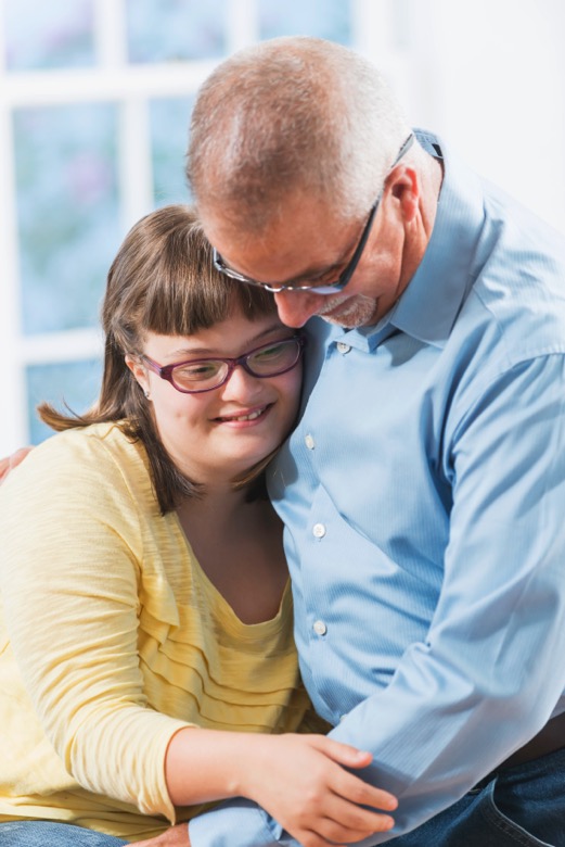 Father and teenage daughter with down syndrome